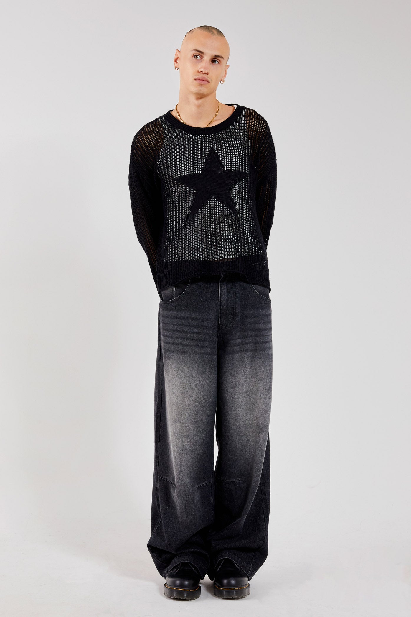 Male wearing Black Star Loose Knit Jumper.