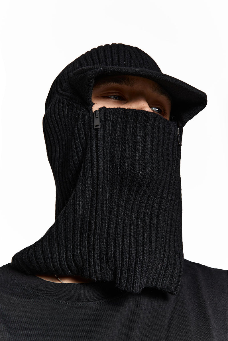 Black knitted balaclava with peak and zip up detail. 