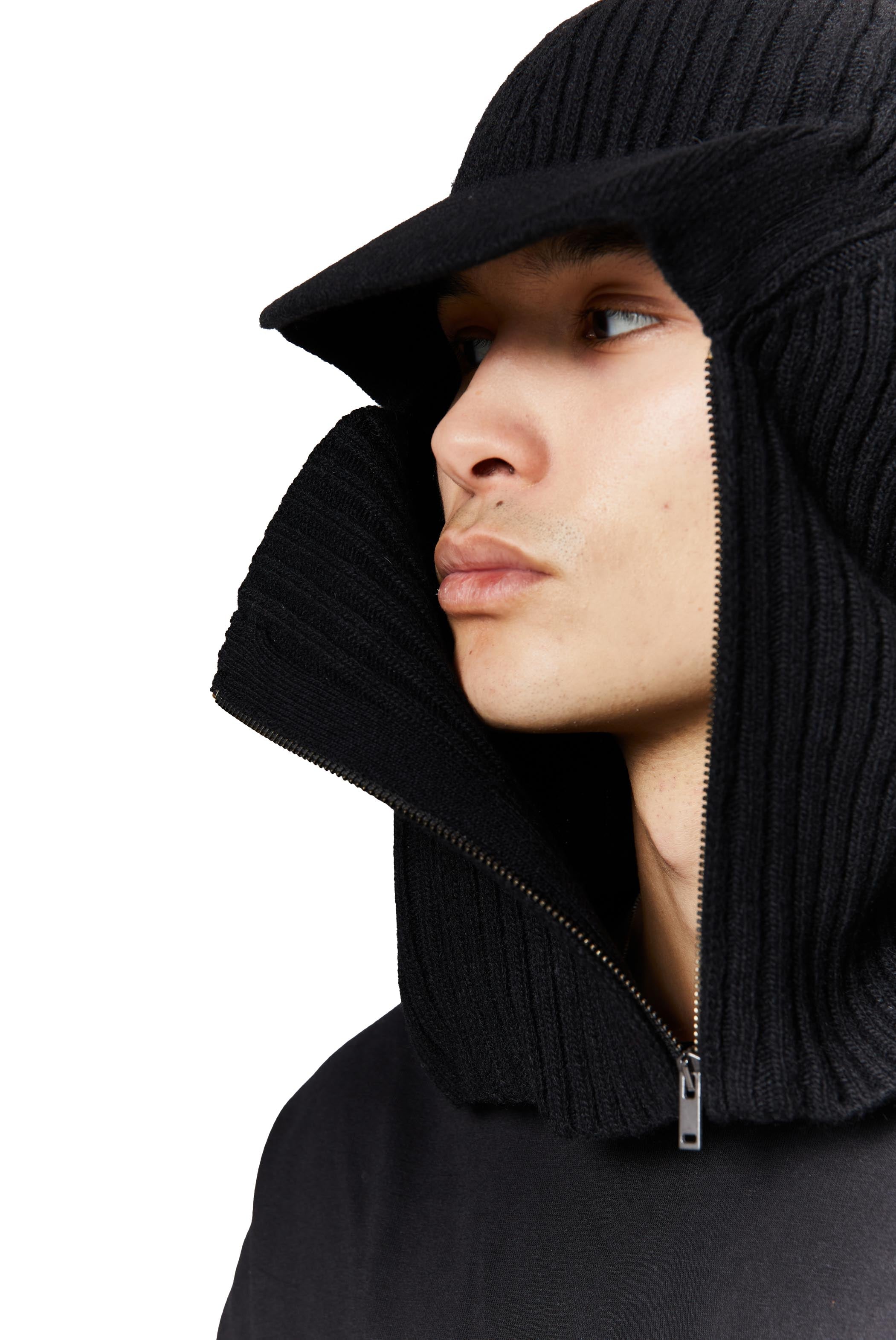 Black knitted balaclava with peak and zip up detail. 