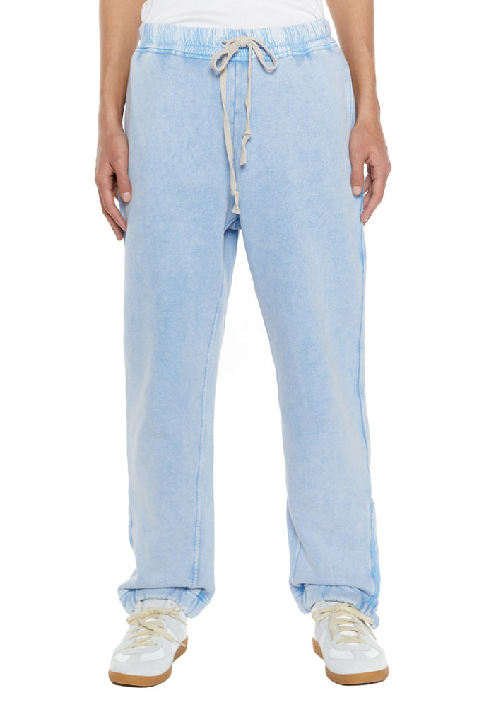 Powder blue cuffed joggers with drawstring waistband. 