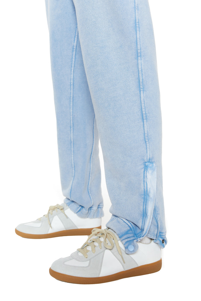 Powder blue cuffed joggers with drawstring waistband. 