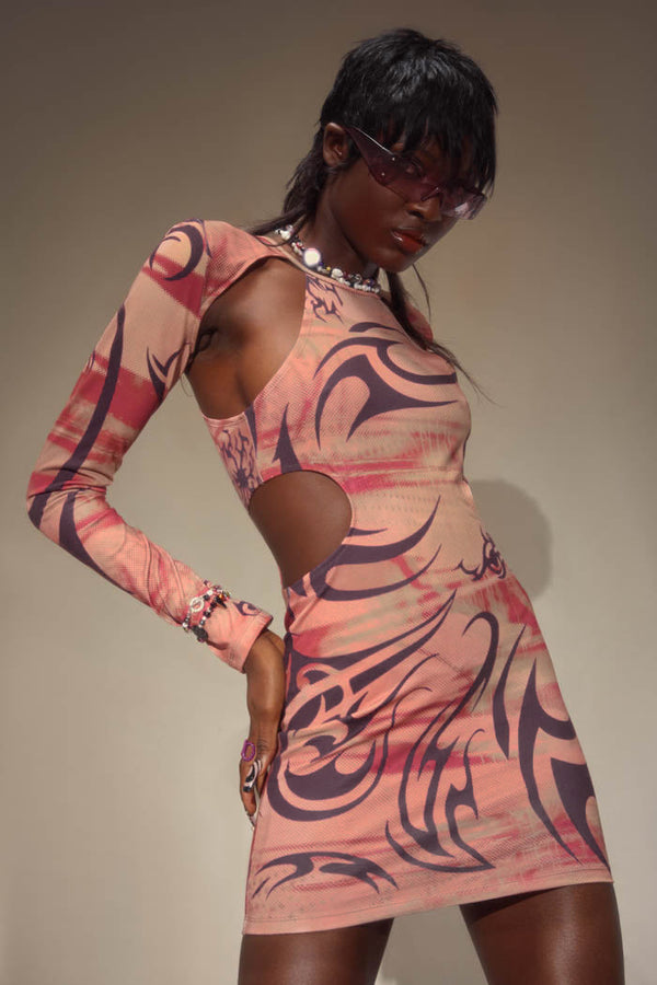 Pink and brown asymmetric tribal print cut out style long sleeve mini dress. 