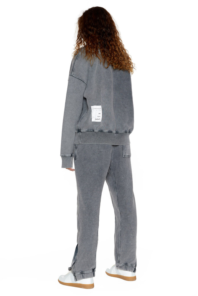 Chrome grey crew neck oversized sweatshirt with ribbed detailing. Styled with matching joggers. 