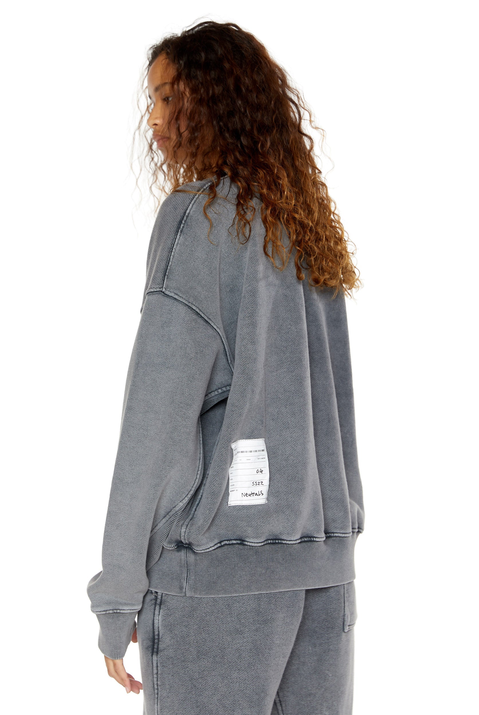 Chrome grey crew neck oversized sweatshirt with ribbed detailing. Styled with matching joggers. 