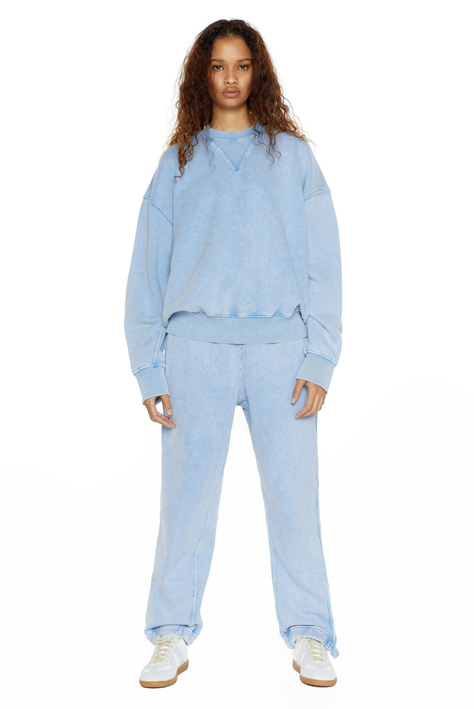 Powder blue oversized crew neck sweatshirt, styled with matching cuffed joggers. 
