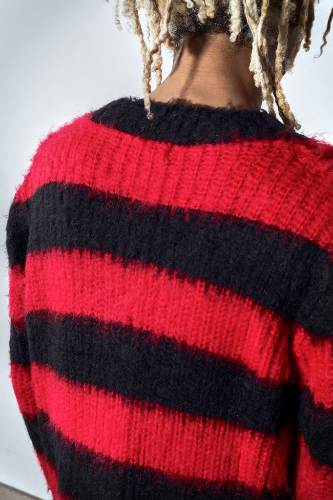 Close up of oversized large stripe black and red knit jumper