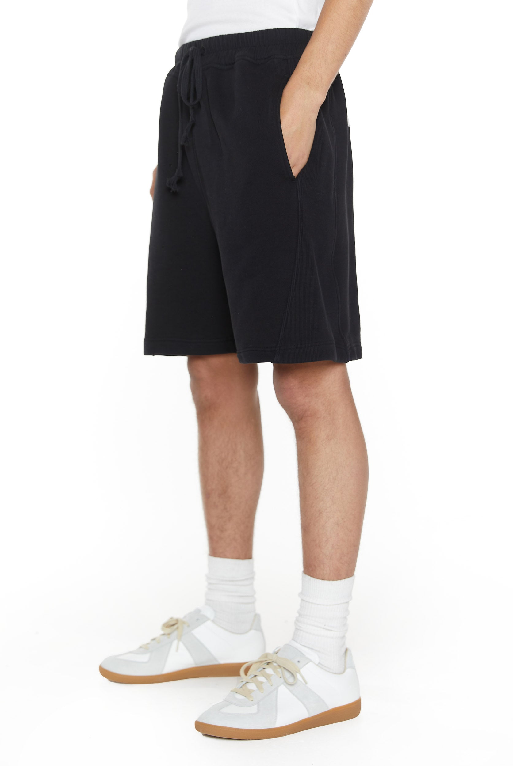 Dust black relaxed fit shorts with drawstring waistband detail. 