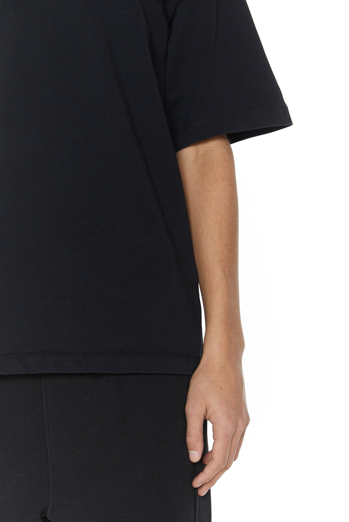 Dust black oversized crew neck t-shirt. Styled with the matching shorts. 