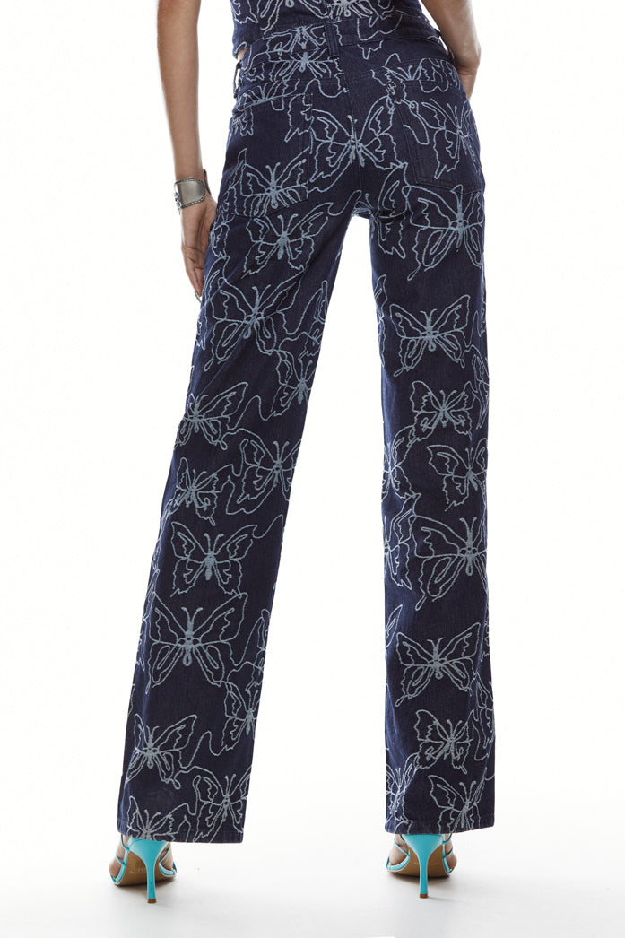 Petite blue butterfly embossed denim jeans in a low rise boyfriend fit.