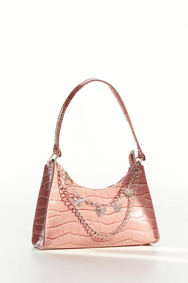 Baby pink crocodile effect shoulder bag with silver butterfly chain detail.