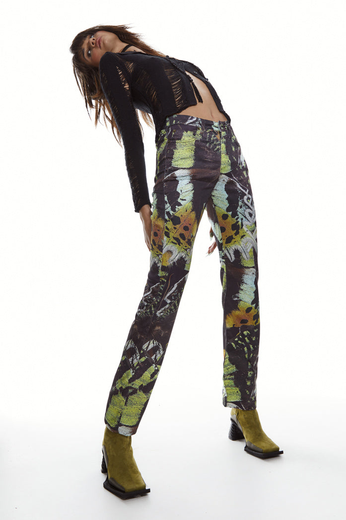 Satin jean style trousers in a mixed butterfly print styled with black shredded long sleeve shirt.