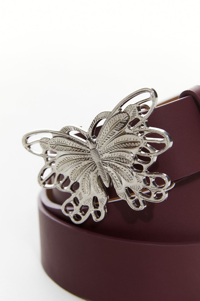 Burgundy belt with silver butterfly pendant.