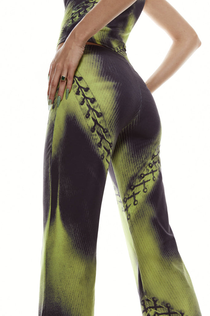 Green safety pin print jersey trousers.