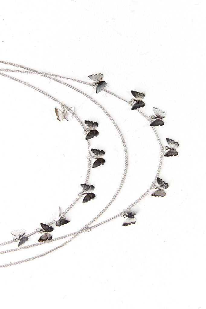 Silver butterfly multi layer chain belt.